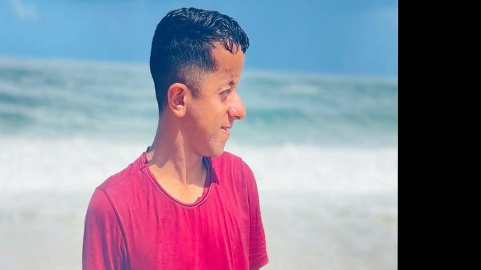 Hakim at Gaza shoreline; tied to Help Gaza family shelter.