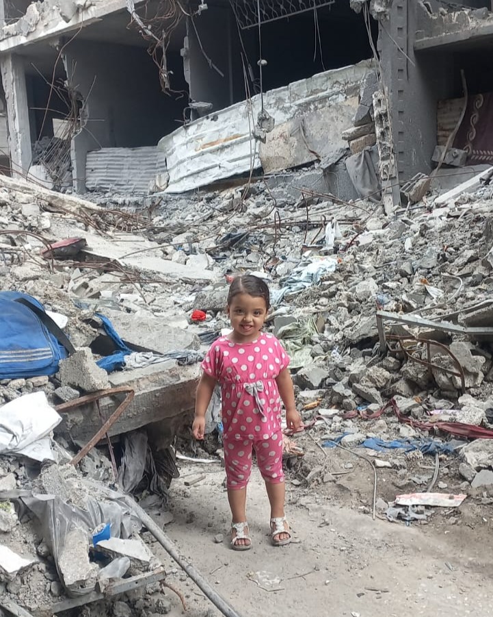 Masa standing amid rubble — urgent need to help family in Gaza.