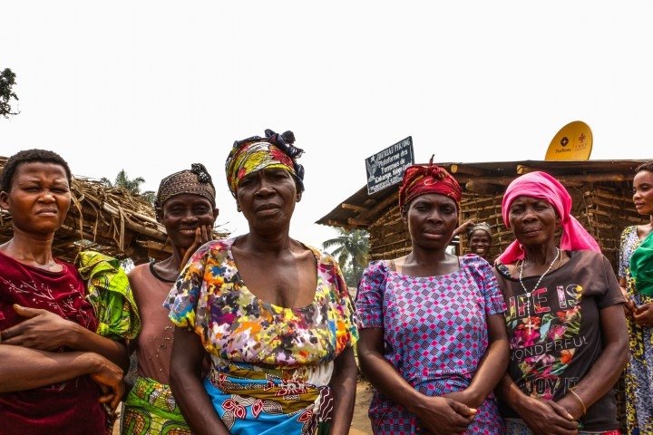 Group of Congolese women standing together in a rural village.